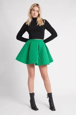 Promise Quilted Mini Skirt 12 Promise Quilted Mini Skirt -Aje S62 22AW4156 EMERALDGREEN PromiseQuiltedMiniSkirt 22312 AjeAthletica 1604 frontshot