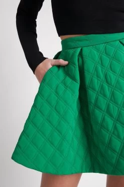 Promise Quilted Mini Skirt 10 Promise Quilted Mini Skirt -Aje S62 22AW4156 EMERALDGREEN PromiseQuiltedMiniSkirt 22312 AjeAthletica 1623 detailshot