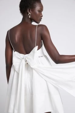 Cantina Mini Bow Back Dress 11 Cantina Mini Bow Back Dress -Aje S79 21RE5166 Cantina Mini Dress Ivory 21365 Aje 2695